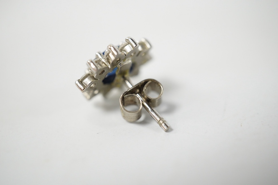 A pair of diamond ear studs, each collet-set with a brilliant-cut diamond weighing approximately 0.20 carats, total diamond weight approximately 0.40 carats, post fittings. Condition - good